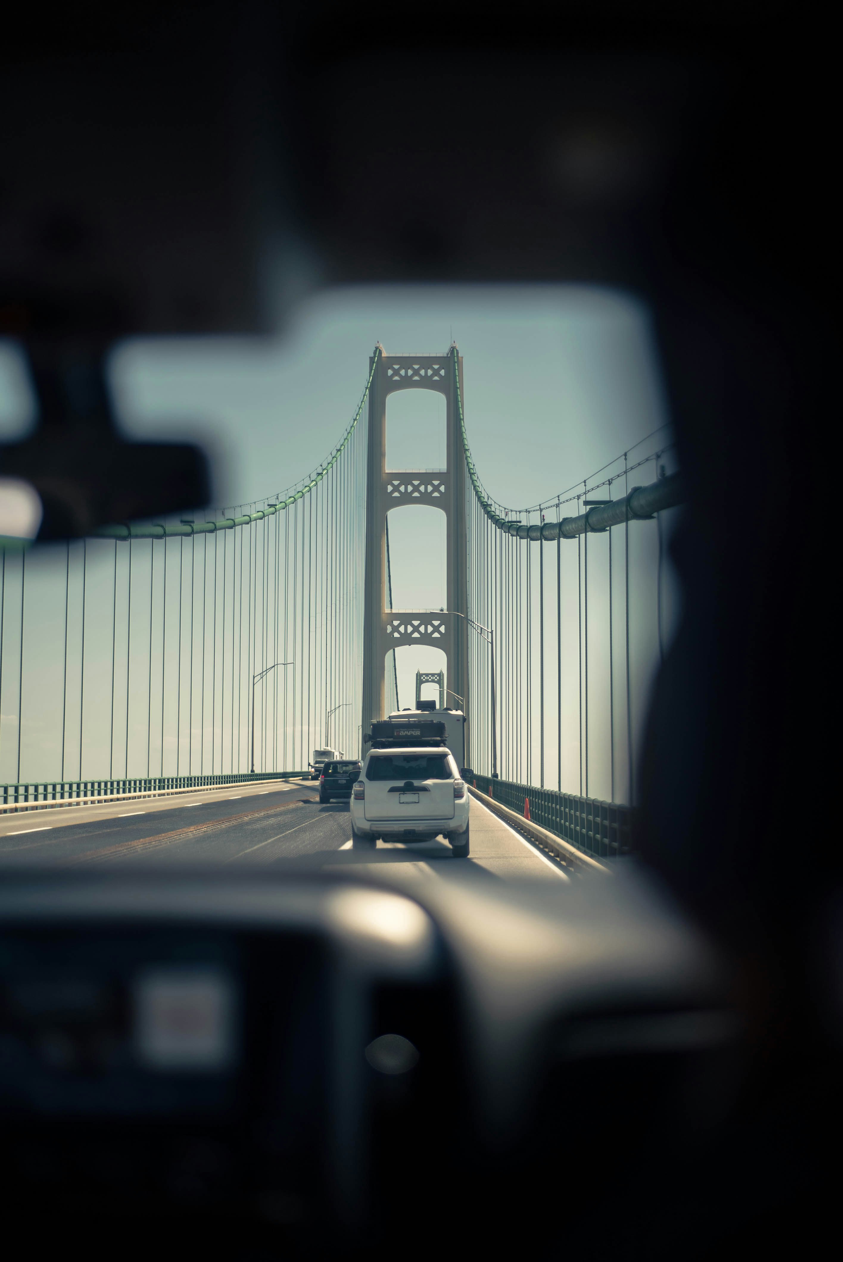 grayscale photo of bridge during daytime